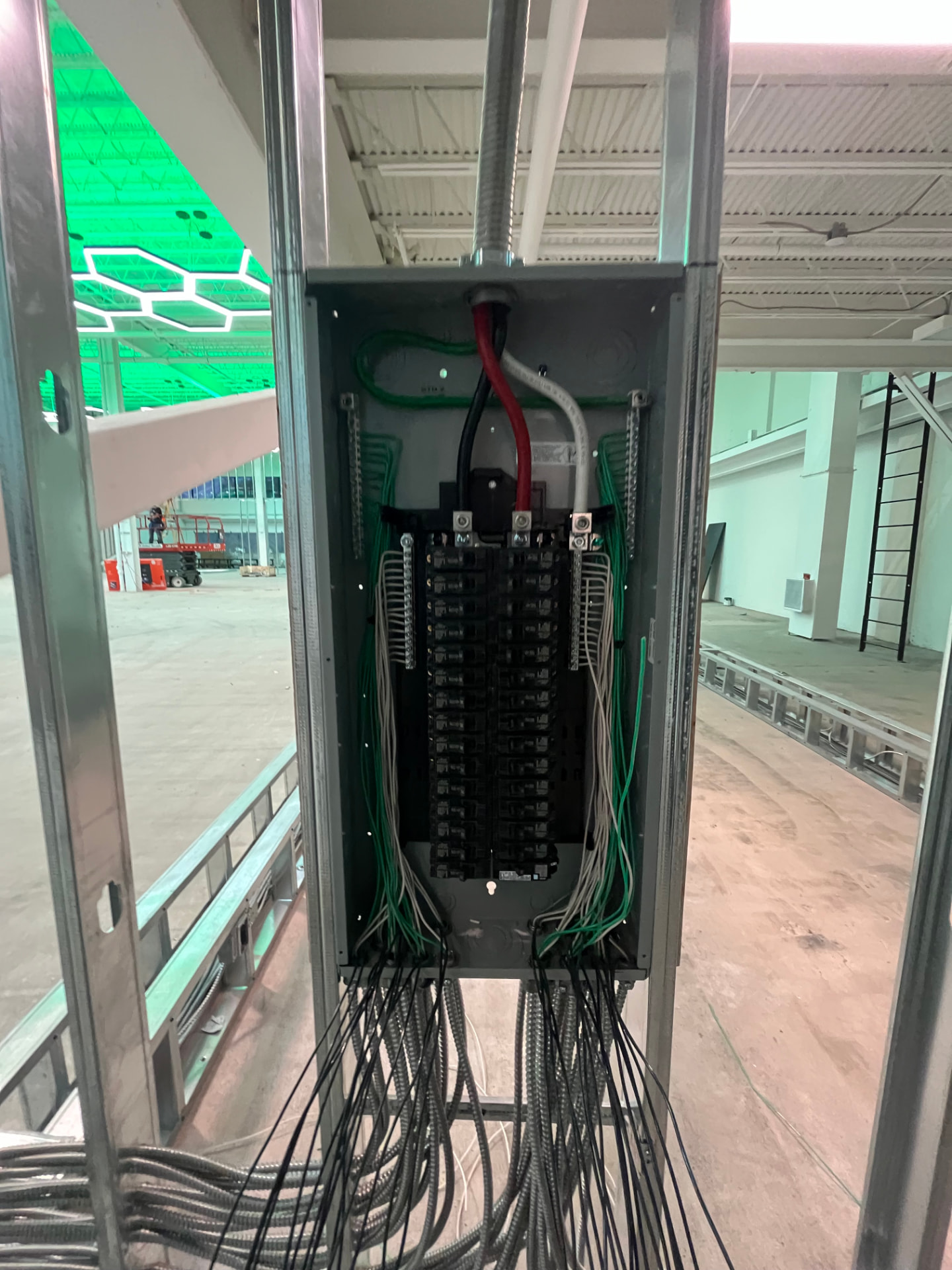 Facility branch panel installed and wired with labeled MC cable homeruns