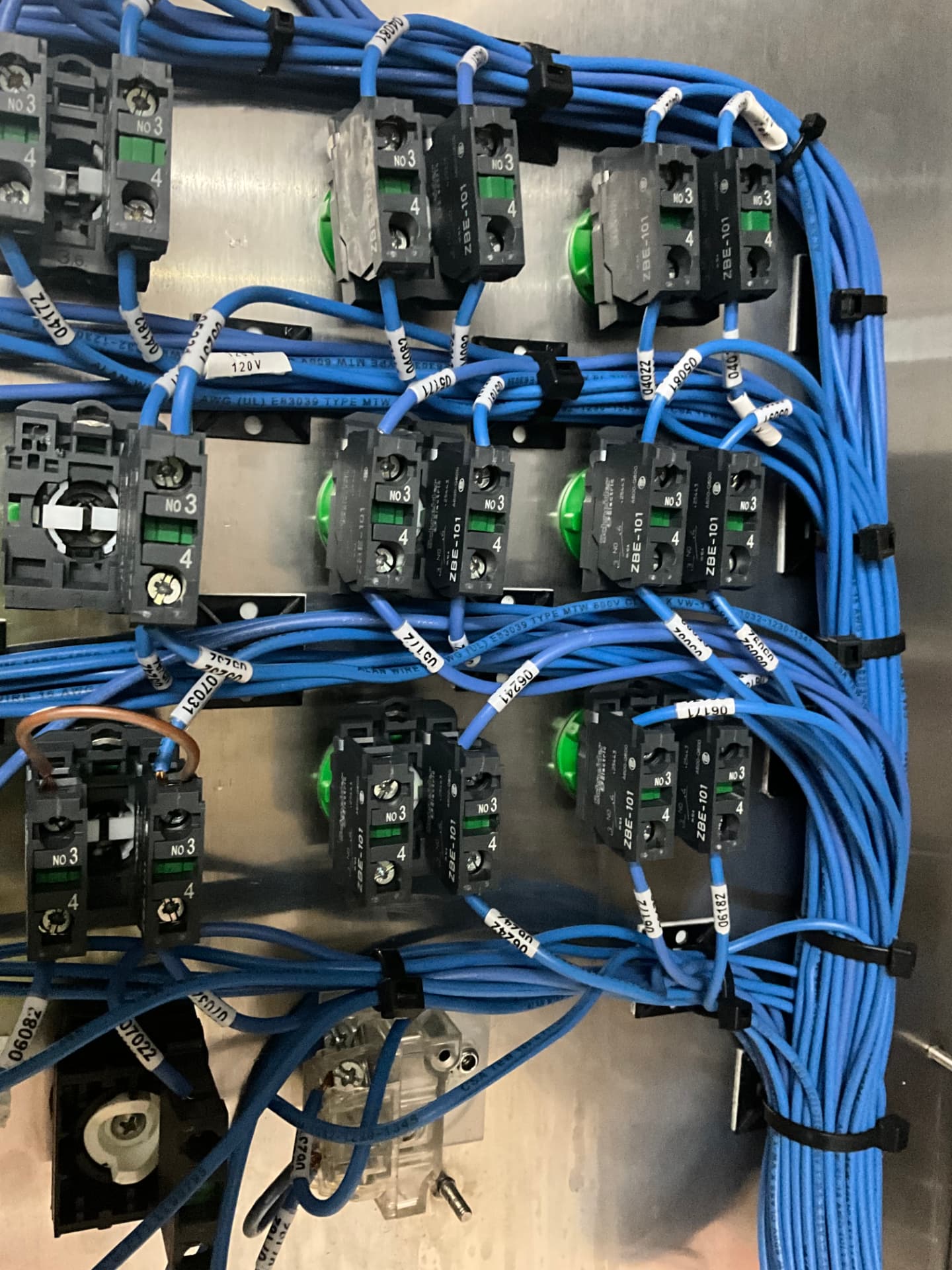 Operator station backplate with Schneider pushbutton contact blocks and dressed control wiring